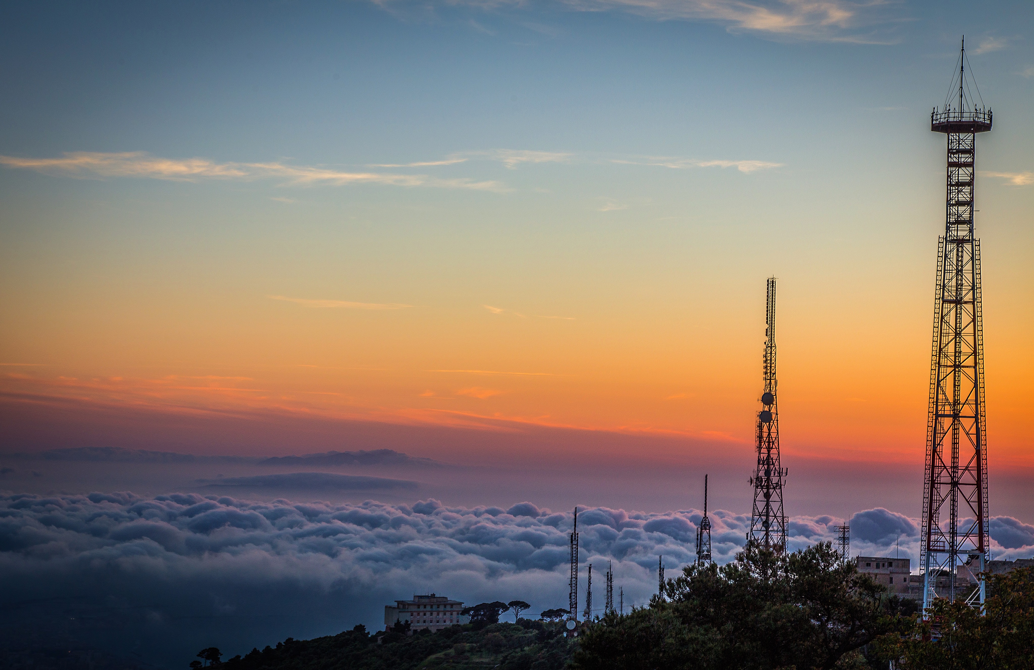 silhouette-communications-tower-against-sky-sunset.jpg